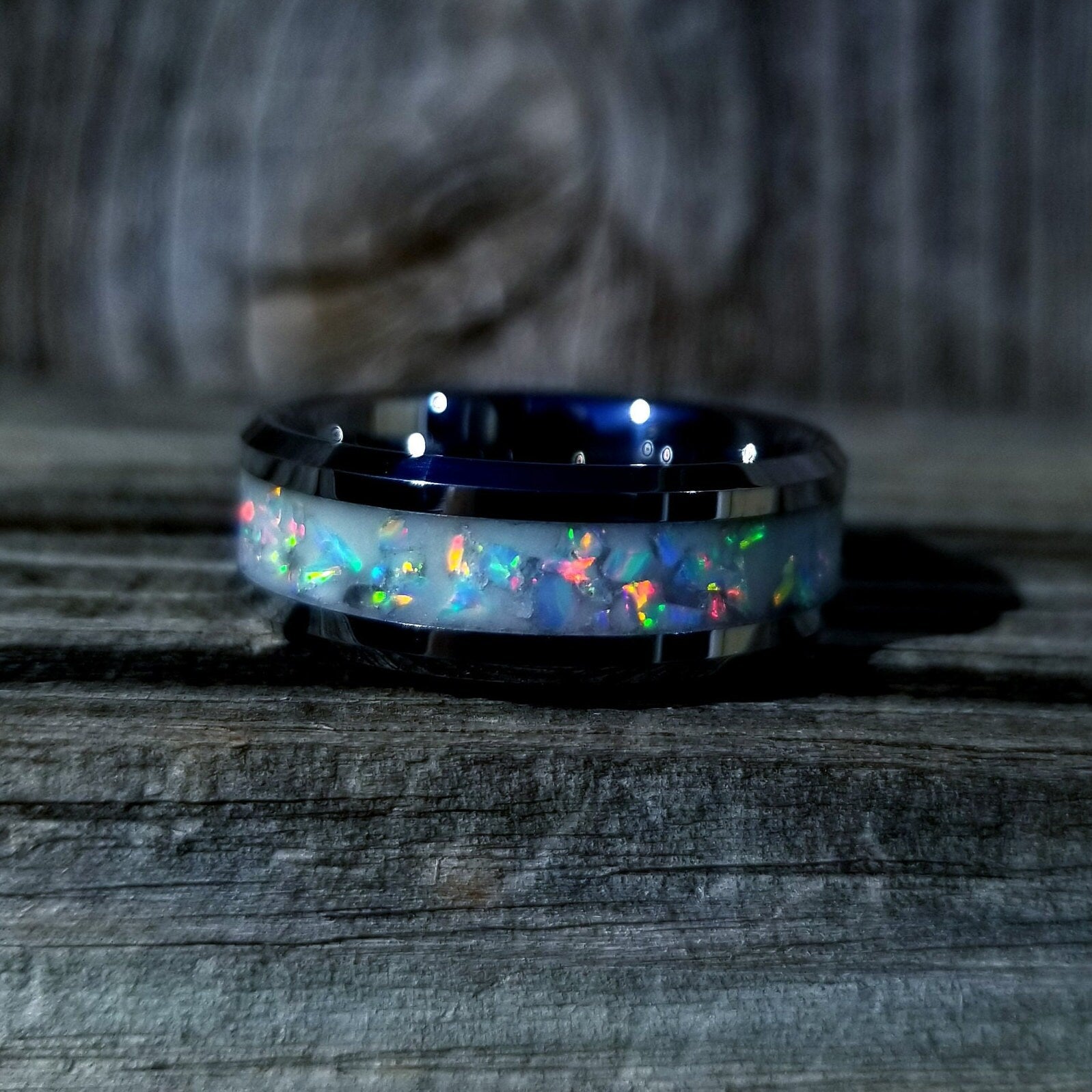 Tungsten carbide glow ring with white opal and glow stone inlay