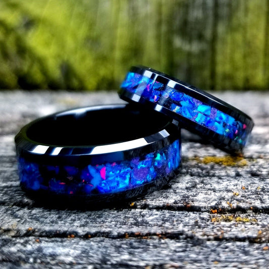 His and Hers wedding ring set. Galaxy fire opal ring. Black ceramic glow ring set with violet opal and blue fire opal inlay. Sizes 5-13